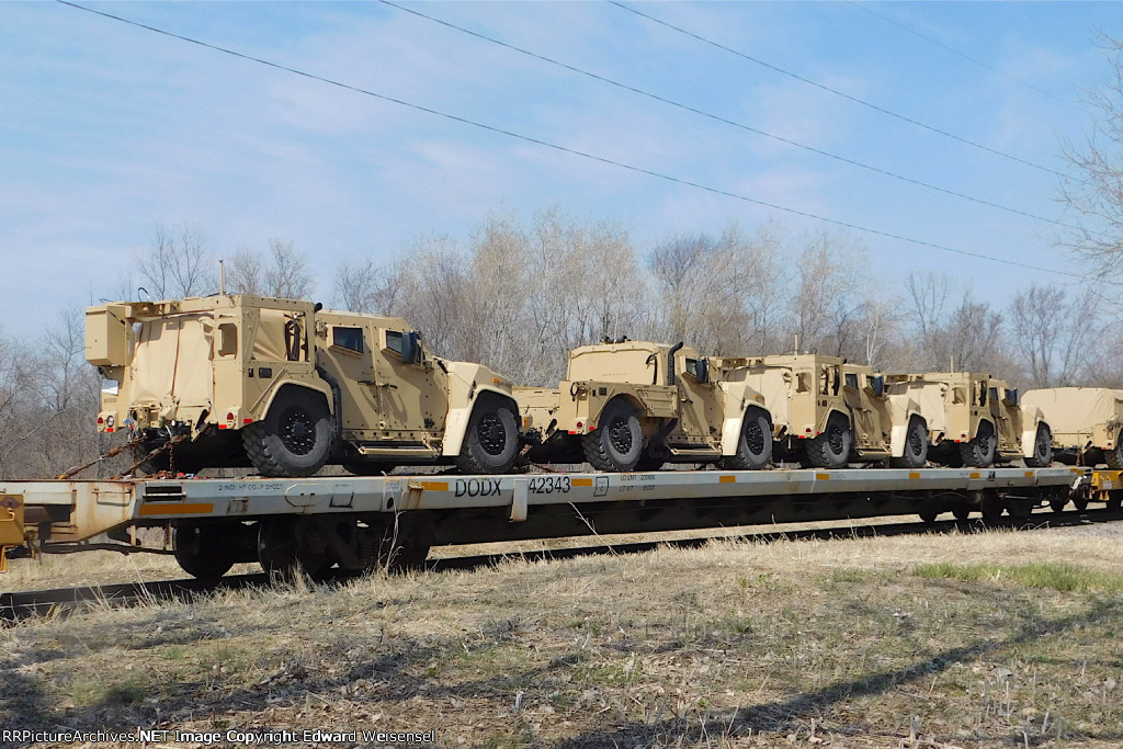 One of over 20 flats with new Oshkosh military vehicles on the Saturday T4